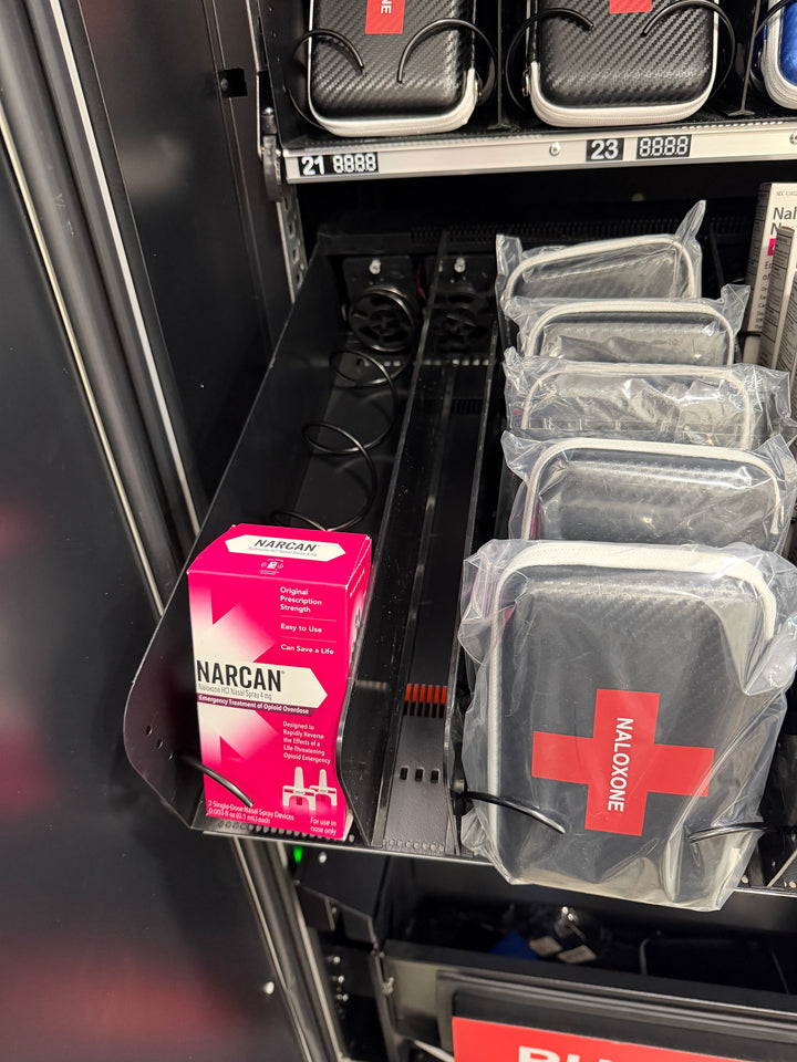 Naloxone and Narcan packaging in a vending machine.