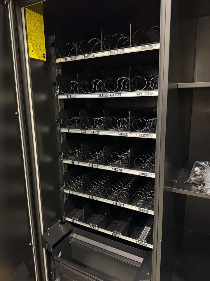 Vending machine rack with inside a black cabinet